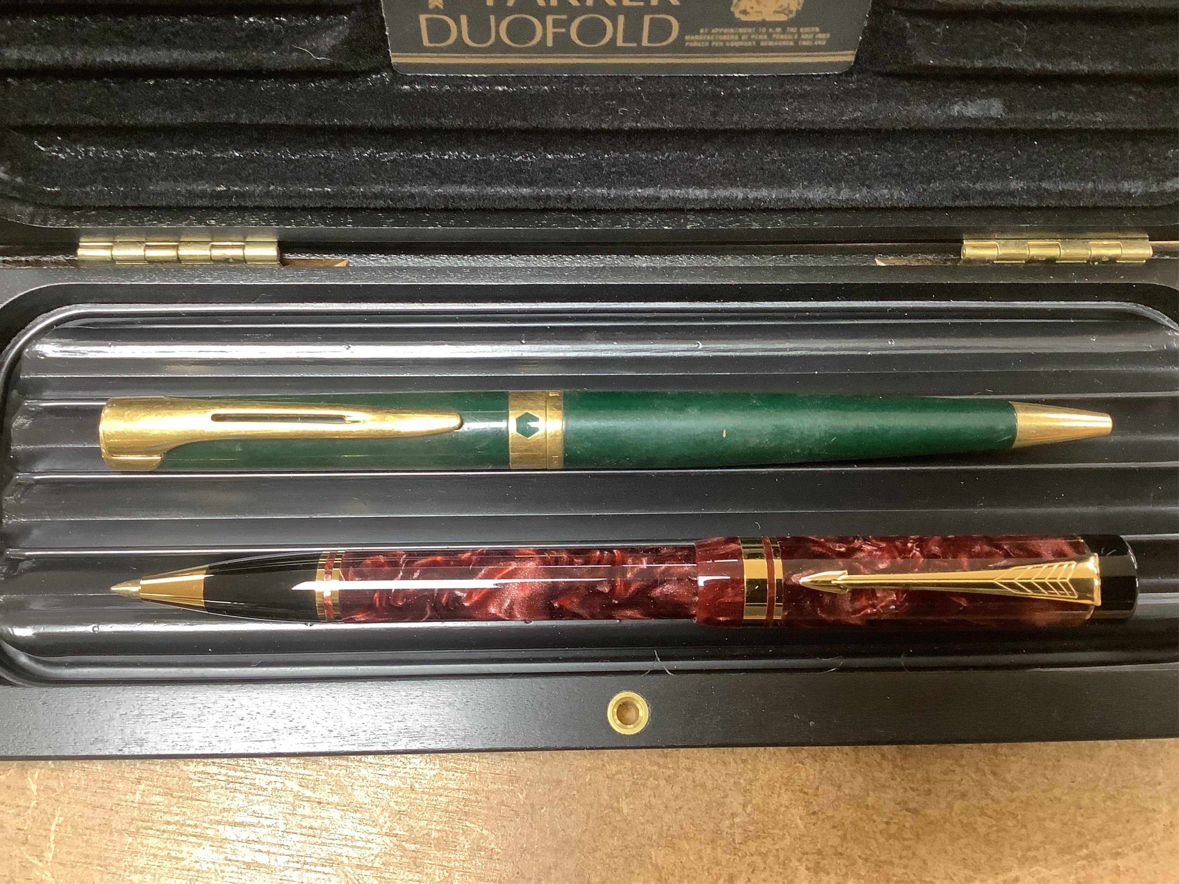 A quantity of various pens to include Parker Duofold and two Parker pen cases. Condition - varies